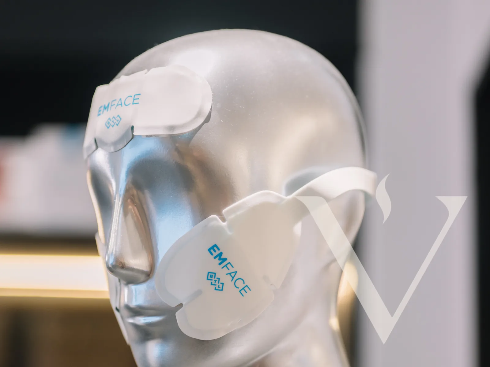EMFACE applicator pads on a display mannequin head at CANVAS Medical Clinic, Penang