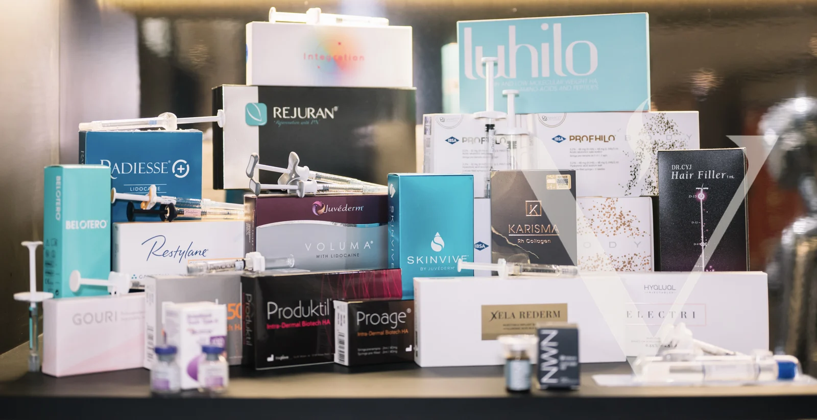 Wall of injectable filler and skinbooster boxes at CANVAS Medical Clinic, Penang