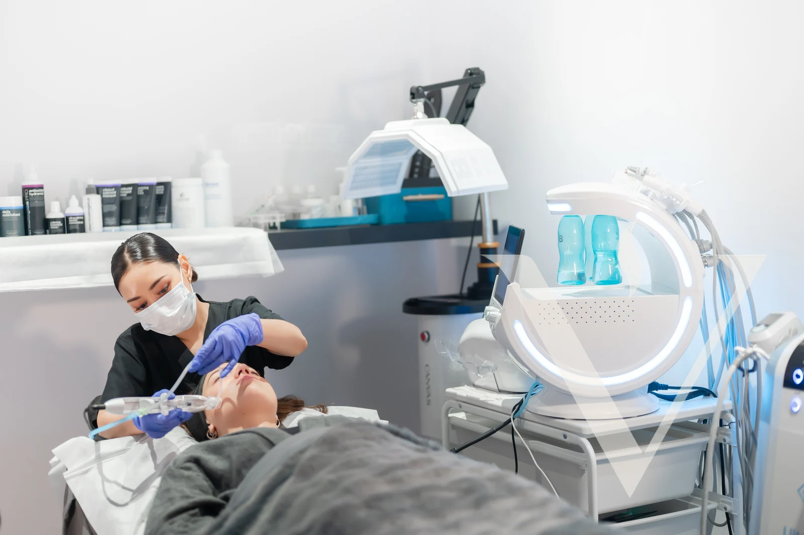 A physician performing a hydrafacial treatment at CANVAS Medical Clinic, Penang