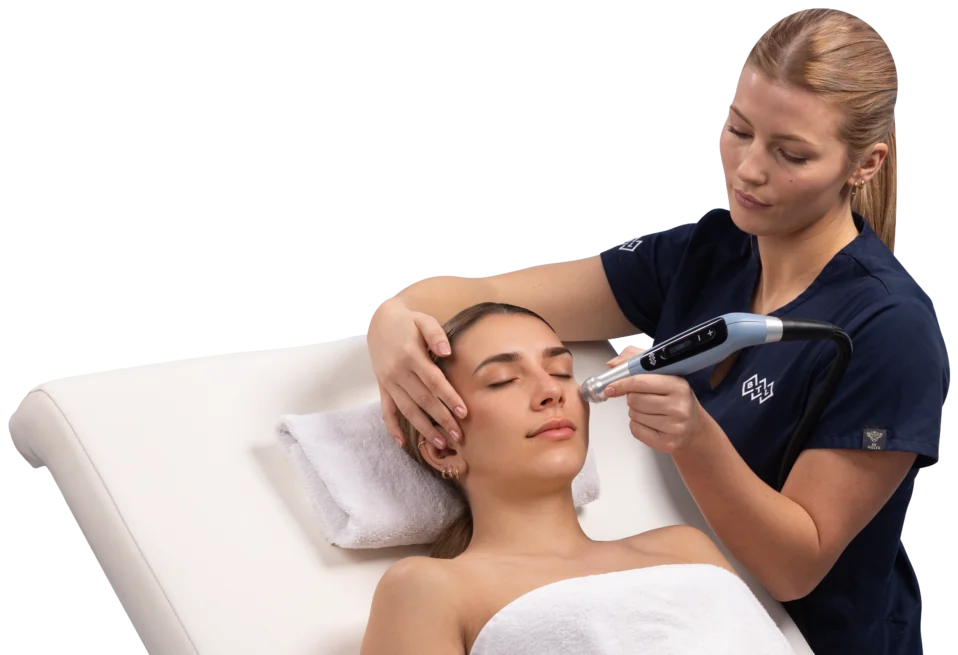 BTL EMFUSION medifacial in progress at CANVAS Medical Clinic, Penang — practitioner treating a client's face with the EMFUSION handpiece